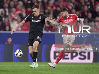 Nicolas Otamendi of SL Benfica competes for the ball with Thijs Dallinga of Bologna Football Club 1909 during the UEFA Champions League matc...