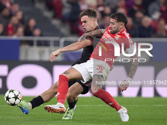 Nicolas Otamendi of SL Benfica competes for the ball with Thijs Dallinga of Bologna Football Club 1909 during the UEFA Champions League matc...