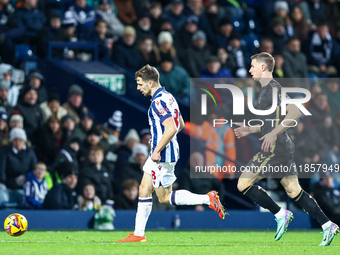 Jayson Molumby of WBA, number 8, is chased by Ben Sheaf of Coventry, number 14, during the Sky Bet Championship match between West Bromwich...