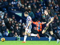 Jayson Molumby of WBA, number 8, is chased by Ben Sheaf of Coventry, number 14, during the Sky Bet Championship match between West Bromwich...