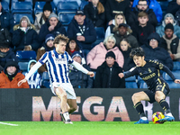 #4, Callum Styles of WBA defends as #7, Tatsuhiro Sakamoto of Coventry turns inside him to press the attack during the Sky Bet Championship...