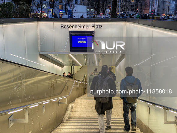 Commuters and pedestrians descend the steps into Rosenheimer Platz suburban train station in Munich, Bavaria, Germany, on December 11, 2024....