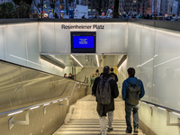 Commuters and pedestrians descend the steps into Rosenheimer Platz suburban train station in Munich, Bavaria, Germany, on December 11, 2024....