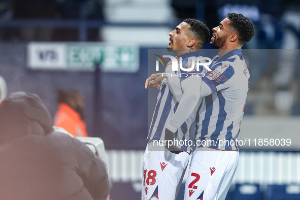 #18, Karlan Grant of WBA is congratulated for his goal by #2, Darnell Furlong during the Sky Bet Championship match between West Bromwich Al...