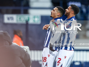 #18, Karlan Grant of WBA is congratulated for his goal by #2, Darnell Furlong during the Sky Bet Championship match between West Bromwich Al...