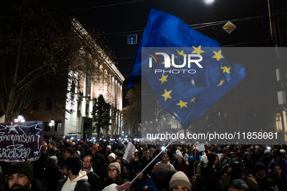 Georgian pro-Europe demonstrators gather during a protest against the government's postponement of European Union accession talks until 2028...