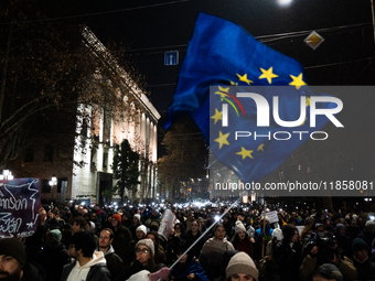 Georgian pro-Europe demonstrators gather during a protest against the government's postponement of European Union accession talks until 2028...