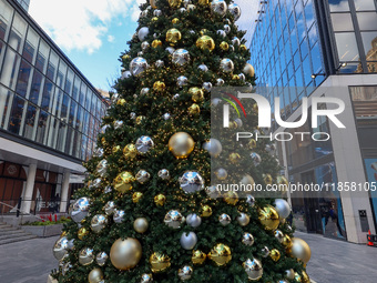 The Christmas tree stands in the plaza outside Madison Square Garden and Penn Station in New York, N.Y., on December 6, 2024. (