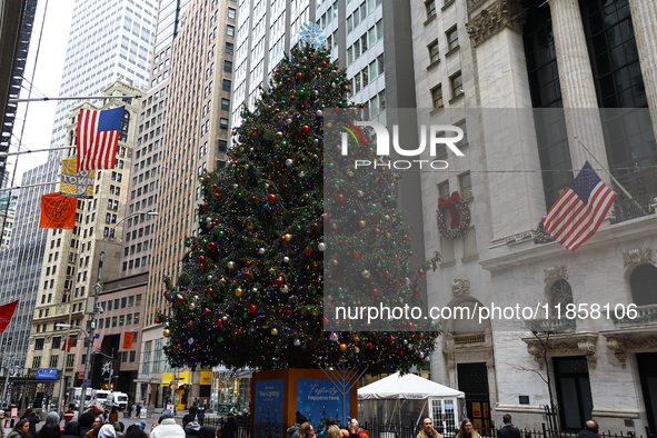 The Christmas tree stands on Broad Street outside the New York Stock Exchange in New York, N.Y., on December 8, 2024. 