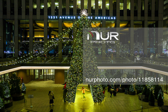 The Christmas tree stands outside of 1221 Avenue of the Americas near Rockefeller Center in New York, N.Y., on December 10, 2024. 