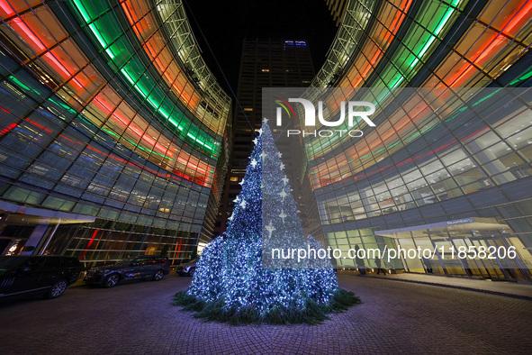 The Christmas tree stands outside the Bloomberg Tower on Beacon Court in New York, N.Y., on December 8, 2024. 