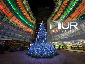 The Christmas tree stands outside the Bloomberg Tower on Beacon Court in New York, N.Y., on December 8, 2024. (