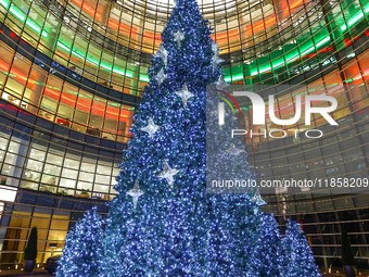 The Christmas tree stands outside the Bloomberg Tower on Beacon Court in New York, N.Y., on December 8, 2024. (