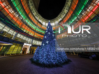 The Christmas tree stands outside the Bloomberg Tower on Beacon Court in New York, N.Y., on December 8, 2024. (