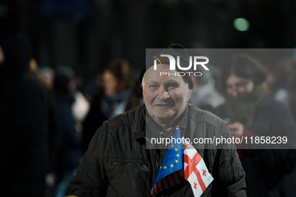 Georgian pro-Europe demonstrators gather during a protest against the government's postponement of European Union accession talks until 2028...