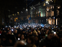 Georgian pro-Europe demonstrators march during a protest against the Government's postponement of European Union accession talks until 2028,...