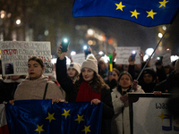 Georgia pro-Europe demonstrators hold Georgian and European flags during a protest against the Government's postponement of European Union a...