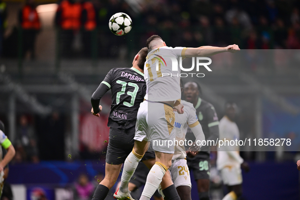 Francesco Camarda of AC Milan and Bruno Duarte of FK Crvena Zvezda battle for the ball during the UEFA Champions League match between AC Mil...