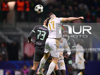 Francesco Camarda of AC Milan and Bruno Duarte of FK Crvena Zvezda battle for the ball during the UEFA Champions League match between AC Mil...