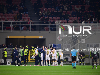 Nemanja Radonjic of FK Crvena Zvezda celebrates after scoring his team's first goal during the UEFA Champions League match between AC Milan...