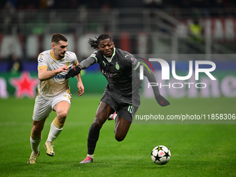 Ivan Gutesa of FK Crvena Zvezda and Rafael Leao of AC Milan battle for the ball during the UEFA Champions League match between AC Milan and...