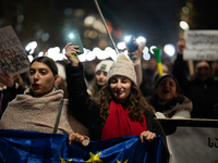 Georgia pro-Europe demonstrators hold Georgian and European flags during a protest against the Government's postponement of European Union a...