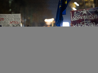 Georgia pro-Europe demonstrators hold Georgian and European flags during a protest against the Government's postponement of European Union a...