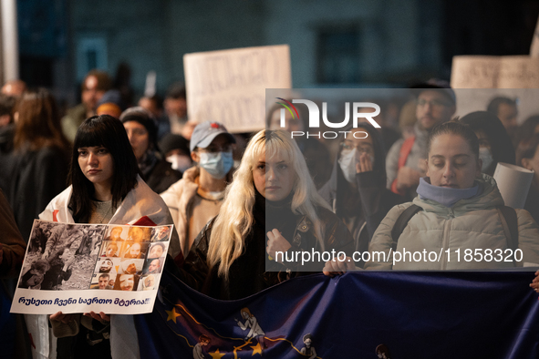 Protesters demonstrate against the government's postponement of European Union accession talks until 2028 outside the Parliament in central...