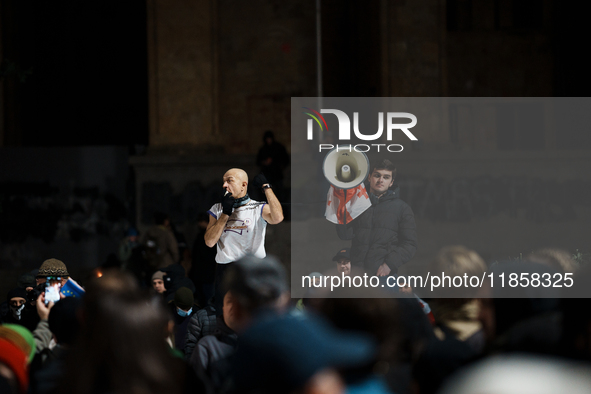 Georgian pro-Europe demonstrators shout slogans as they gather during a protest against the government's postponement of European Union acce...