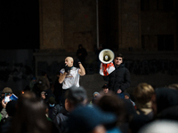 Georgian pro-Europe demonstrators shout slogans as they gather during a protest against the government's postponement of European Union acce...