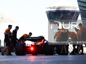 McLaren mechanics during the Formula 1 post-season testing at Yas Marina Cicuit in Abu Dhabi, United Arab Emirates on December 10, 2024. (