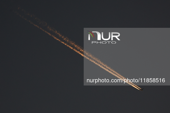 A plane flies during the Formula 1 post-season testing at Yas Marina Cicuit in Abu Dhabi, United Arab Emirates on December 10, 2024. 