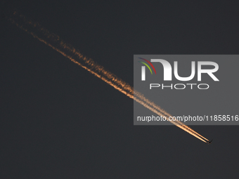 A plane flies during the Formula 1 post-season testing at Yas Marina Cicuit in Abu Dhabi, United Arab Emirates on December 10, 2024. (