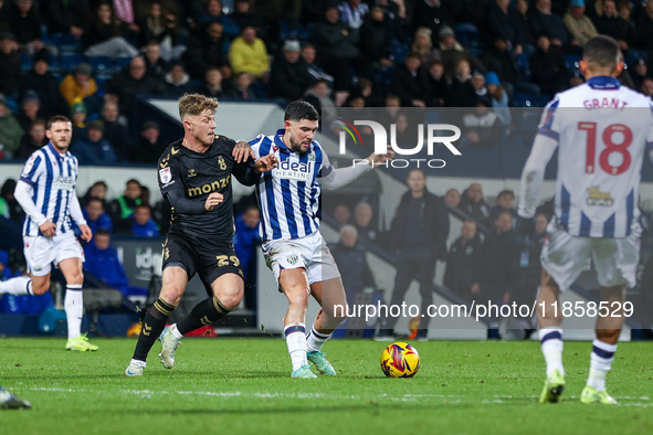 Victor Torp of Coventry and Alex Mowatt of WBA battle for possession during the Sky Bet Championship match between West Bromwich Albion and...