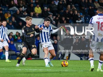 Victor Torp of Coventry and Alex Mowatt of WBA battle for possession during the Sky Bet Championship match between West Bromwich Albion and...