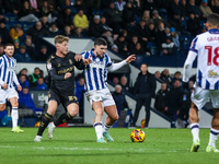 Victor Torp of Coventry and Alex Mowatt of WBA battle for possession during the Sky Bet Championship match between West Bromwich Albion and...