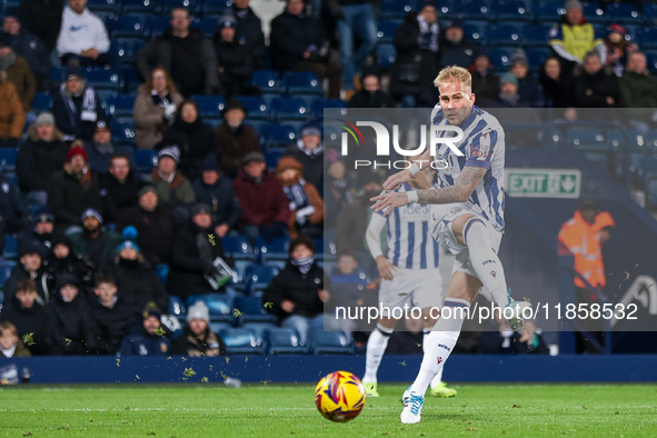 Uros Racic of WBA attempts a shot on goal in the final minutes of the game during the Sky Bet Championship match between West Bromwich Albio...