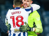 Number 18, Karlan Grant of WBA, is congratulated at full-time by number 1, goalkeeper Alex Palmer, during the Sky Bet Championship match bet...