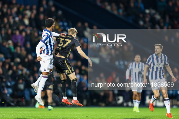 Mason Holgate of WBA and Norman Bassette of Coventry battle in the air during the Sky Bet Championship match between West Bromwich Albion an...