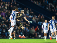 Mason Holgate of WBA and Norman Bassette of Coventry battle in the air during the Sky Bet Championship match between West Bromwich Albion an...