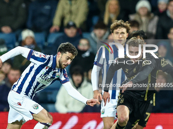 #22, Mikey Johnston of WBA, is in attacking action as #5, Jack Rudoni of Coventry, moves to intercept during the Sky Bet Championship match...