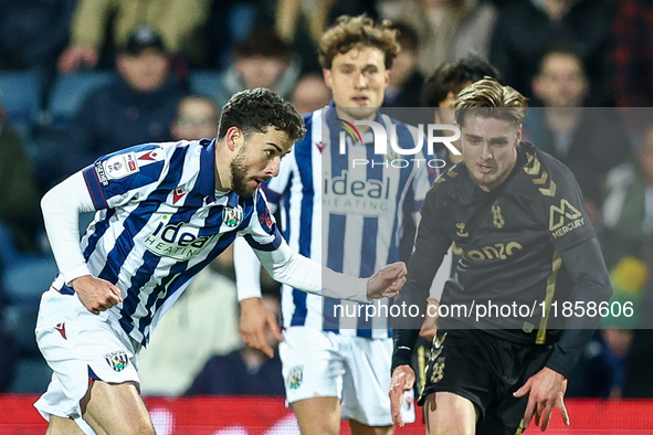 #22, Mikey Johnston of WBA, is in attacking action as #5, Jack Rudoni of Coventry, moves to intercept during the Sky Bet Championship match...