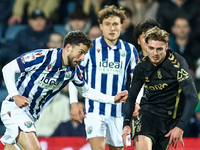 #22, Mikey Johnston of WBA, is in attacking action as #5, Jack Rudoni of Coventry, moves to intercept during the Sky Bet Championship match...