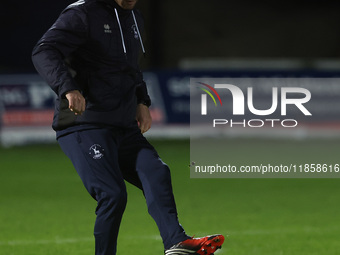 Hartlepool United strength and conditioning coach Carl Dickinson warms up during the The Isuzu FA Trophy Third Round match between Hartlepoo...