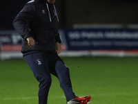 Hartlepool United strength and conditioning coach Carl Dickinson warms up during the The Isuzu FA Trophy Third Round match between Hartlepoo...