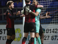 Tamworths' Jas Singh celebrates with Dan Creaney after they won a penalty shoot during the The Isuzu FA Trophy Third Round match between Har...