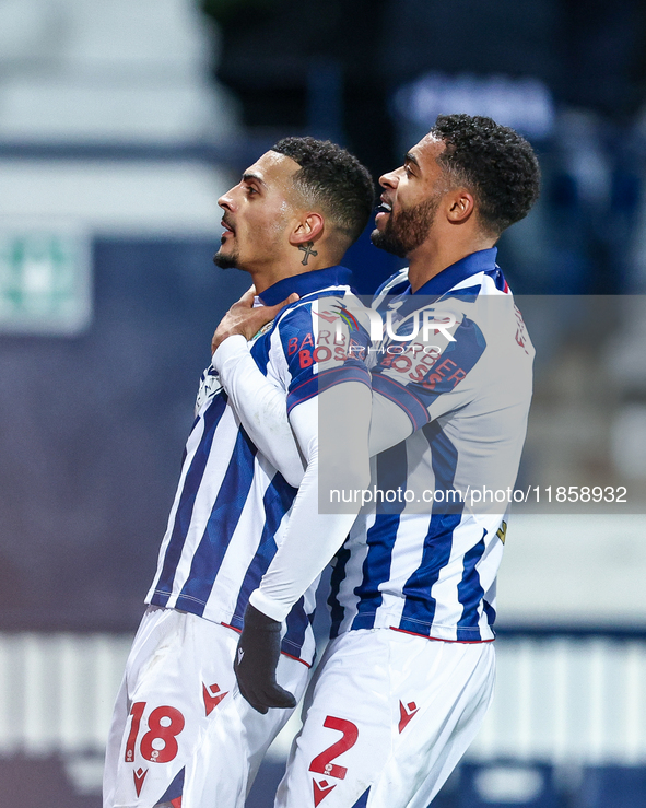 #18, Karlan Grant of WBA is congratulated for his goal by #2, Darnell Furlong during the Sky Bet Championship match between West Bromwich Al...