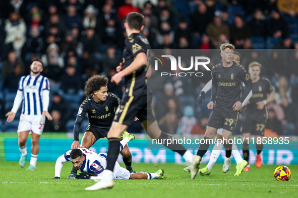 #22, Joel Latibeaudiere of Coventry stands over #18, Karlan Grant of WBA during the Sky Bet Championship match between West Bromwich Albion...