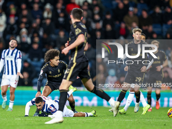 #22, Joel Latibeaudiere of Coventry stands over #18, Karlan Grant of WBA during the Sky Bet Championship match between West Bromwich Albion...