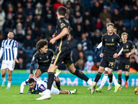 #22, Joel Latibeaudiere of Coventry stands over #18, Karlan Grant of WBA during the Sky Bet Championship match between West Bromwich Albion...